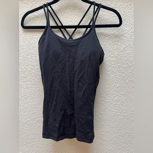 Lululemon black yoga tank.  Cross back. Flattering. Size 4.  Only worn once.